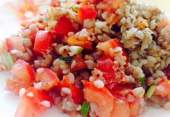 Buckwheat porridge with tomatoes, carrots and onions in diet menu